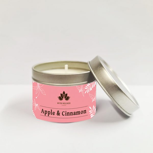 apple & cinnamon soy wax candle in a light salmon coloured tin